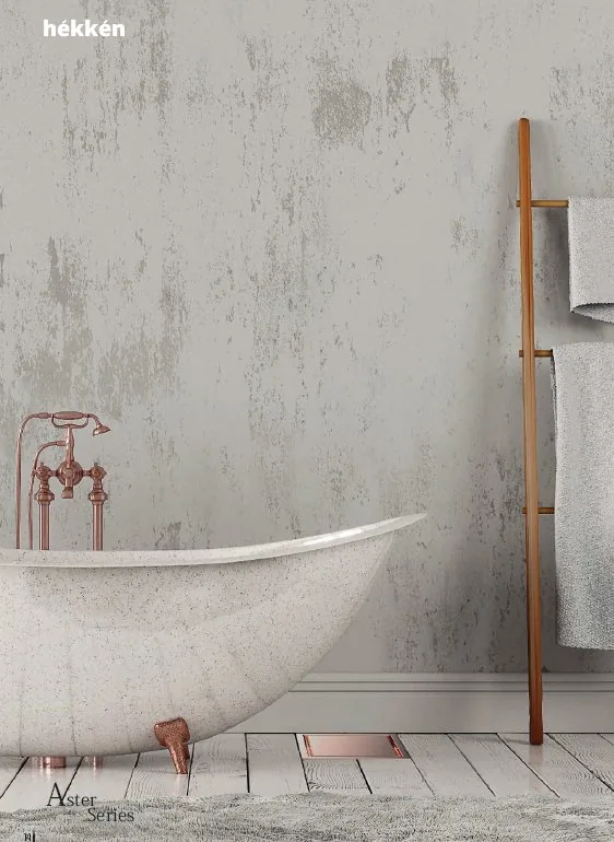 hékkén Aster Series — rose gold clawfoot bathtub with textured plaster wall